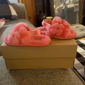 A pair of toddler girls UGG sandals